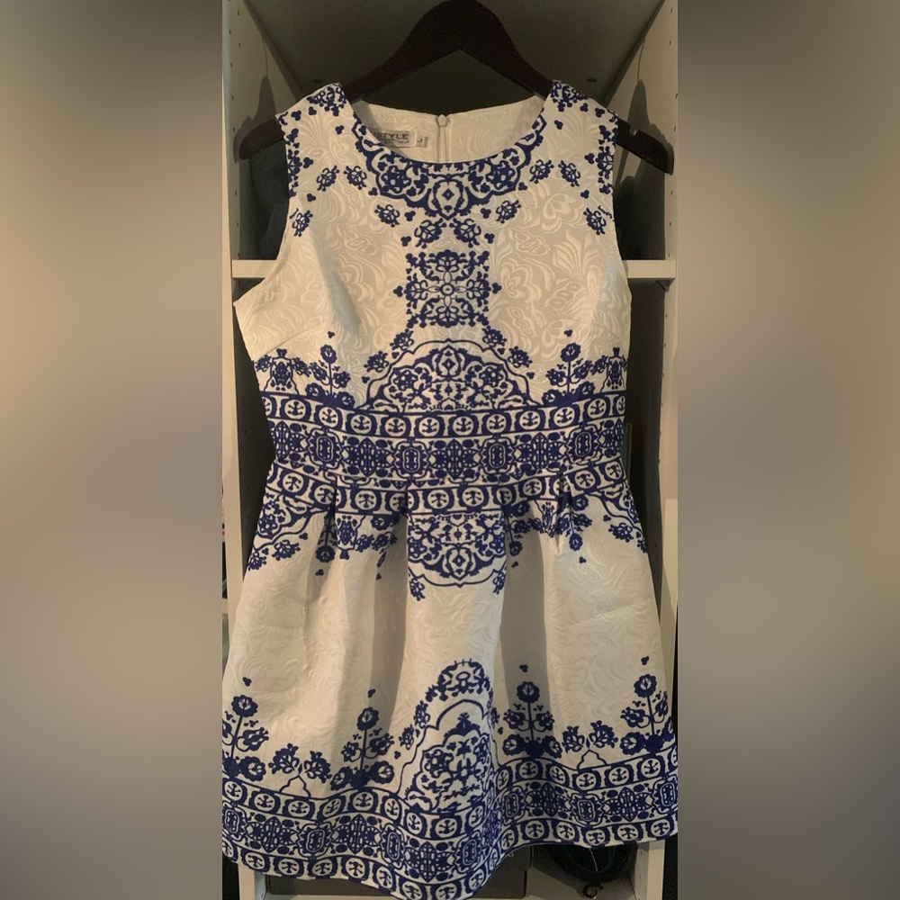 Stylish summer dress. Fitted in the bodice and a bell shaped mini skirt.